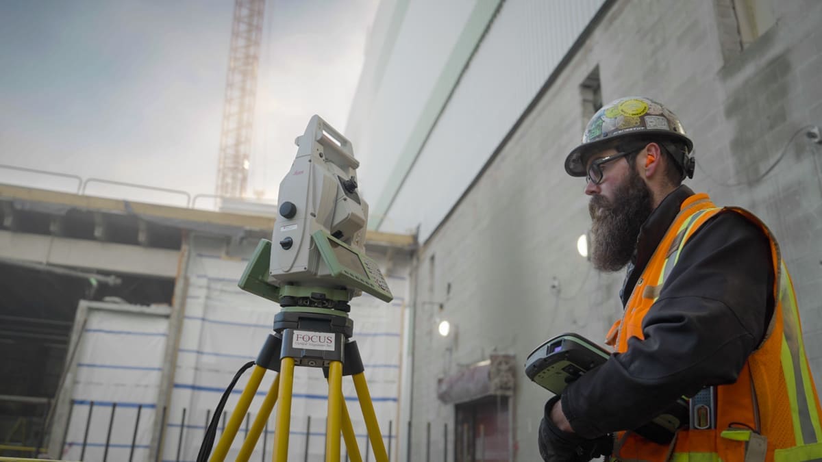 Alignment operator uses equipment at jobsite